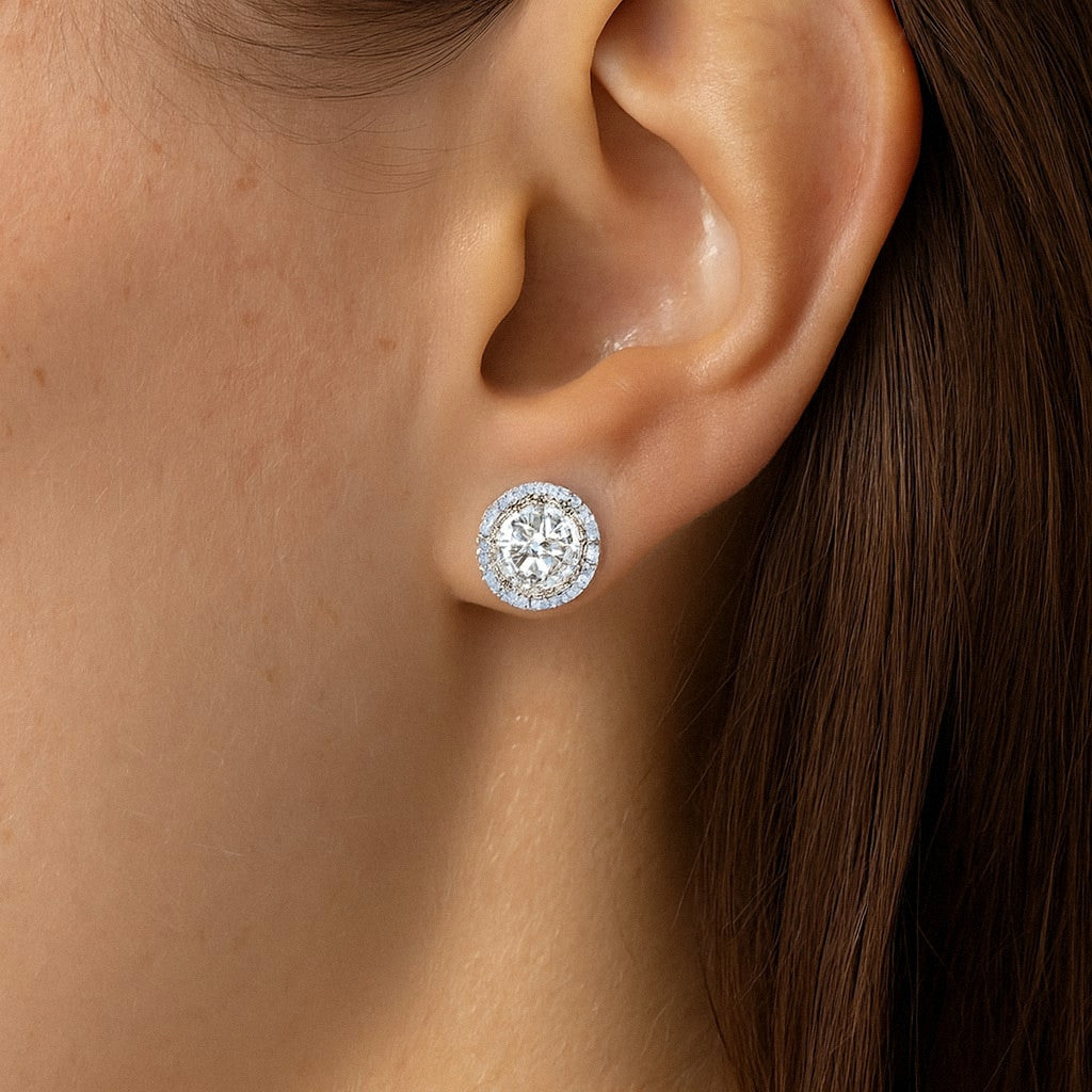 Halo Moissanite Stud Earrings in 925 Sterling Silver, worn on model for scale