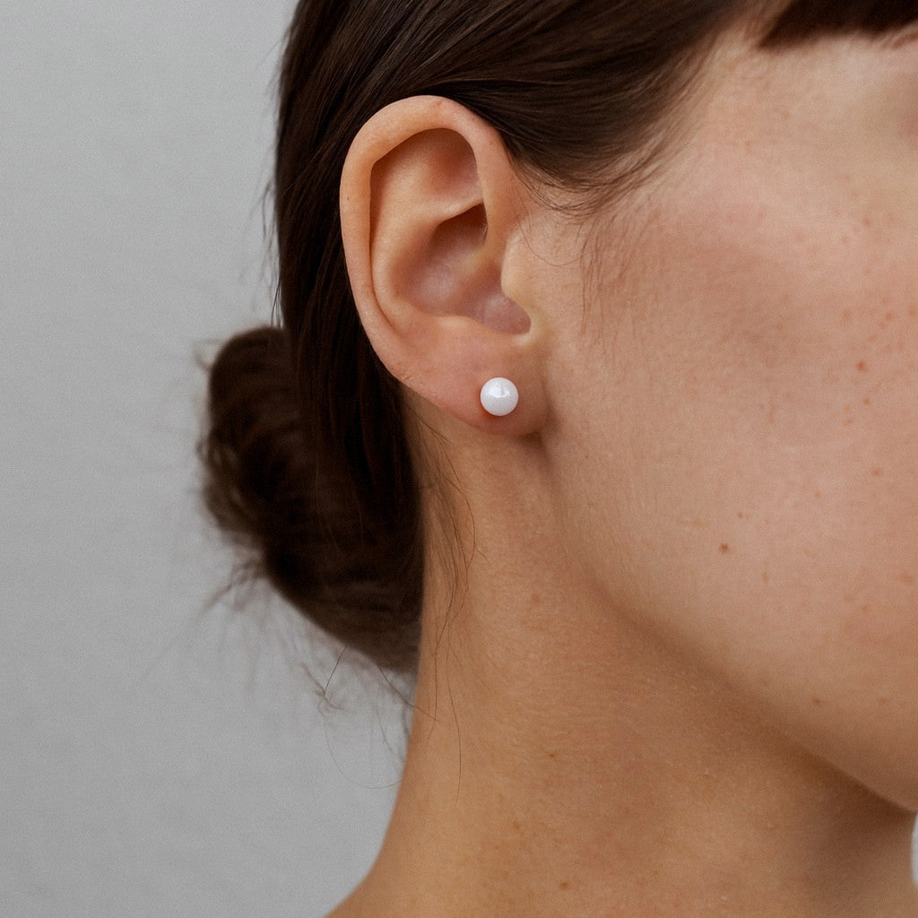 Freshwater pearl stud earrings worn