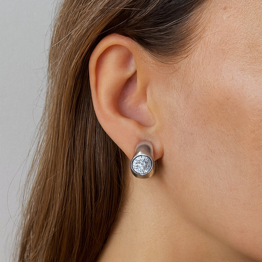 Silver Huggie Earrings with Moissanite, Chunky Dome Hoops in 925 Sterling Silver, worn on model for scale