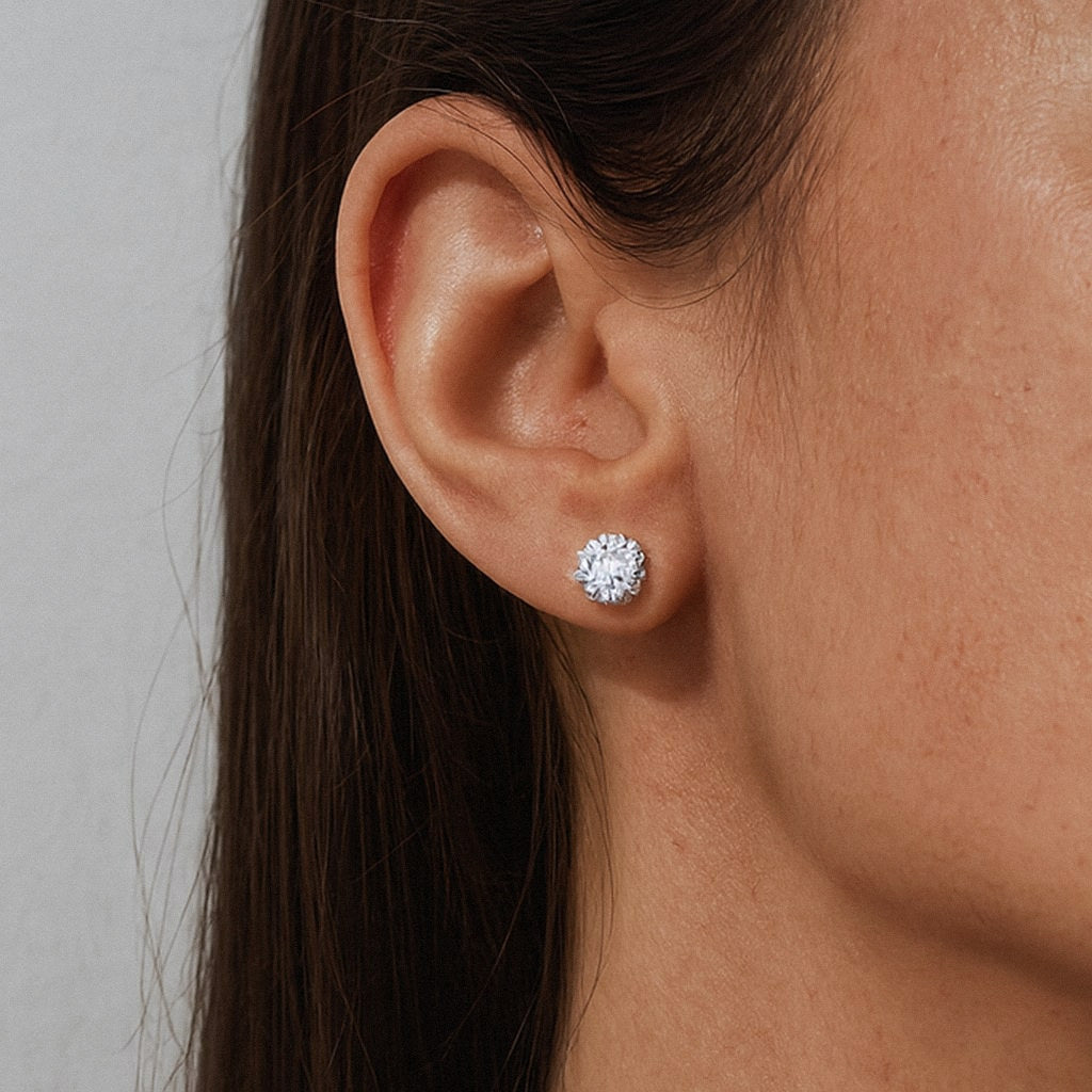 Moissanite Stud Earrings, Classic Four-Prong Solitaire Studs in 925 Sterling Silver, worn on model for scale