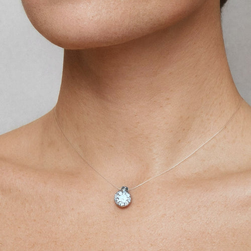 Floating Moissanite Necklace, Invisible Illusion Chain with Sterling Silver Solitaire, worn on model for scale