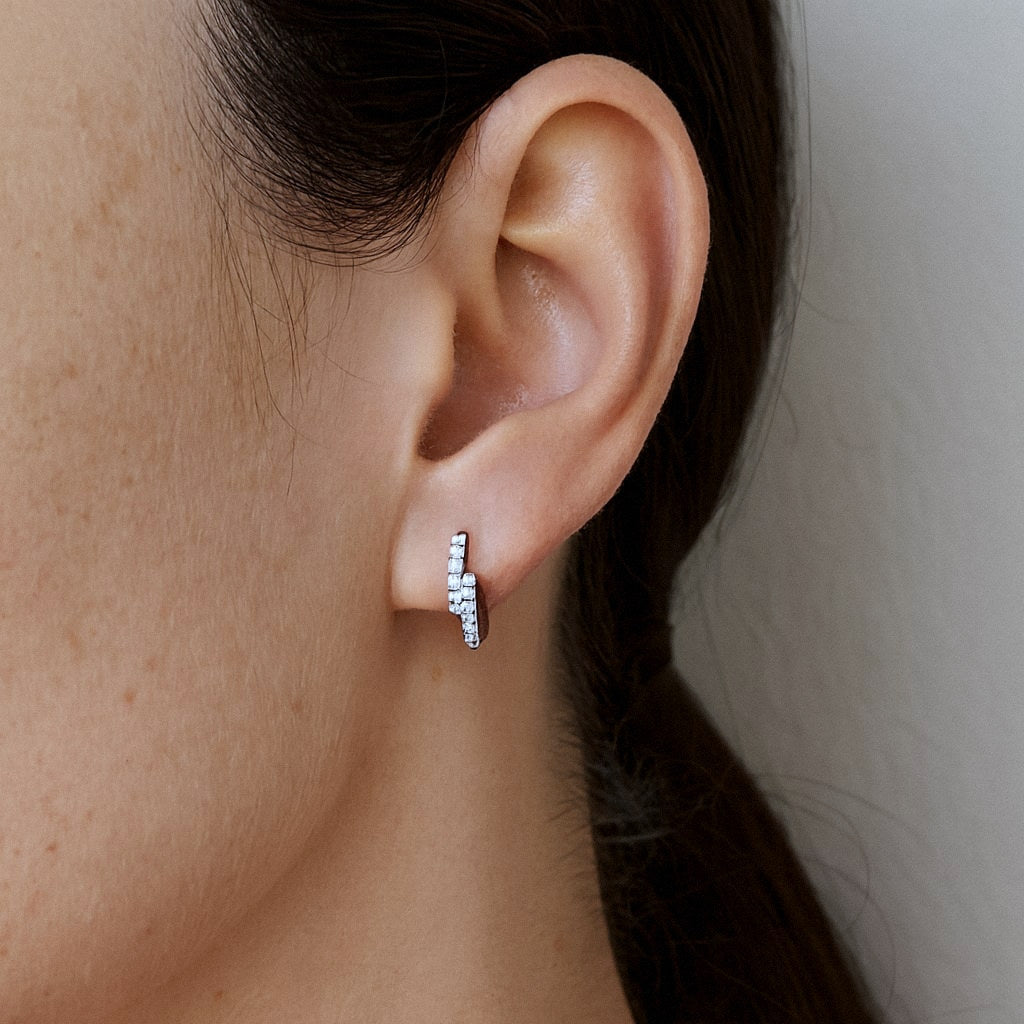 Pavé Huggie Earrings, Double Row Moissanite Huggies in 925 Sterling Silver, worn on model for scale