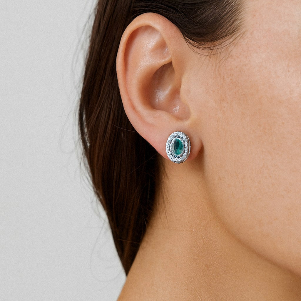 Green Oval Halo Stud Earrings, Green Moissanite in 925 Sterling Silver, worn on model for scale