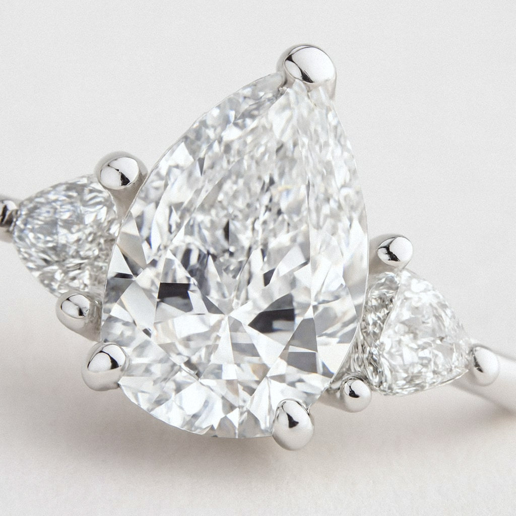 Pear Moissanite Ring, Pear Cut with Side Stones in 925 Sterling Silver, close-up detail