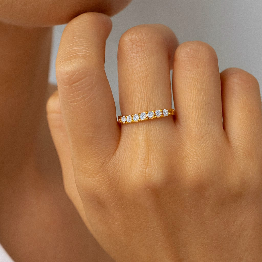 Gold Seven Stone Moissanite Stacking Ring, 18k Gold Plated Sterling Silver, worn on model for scale
