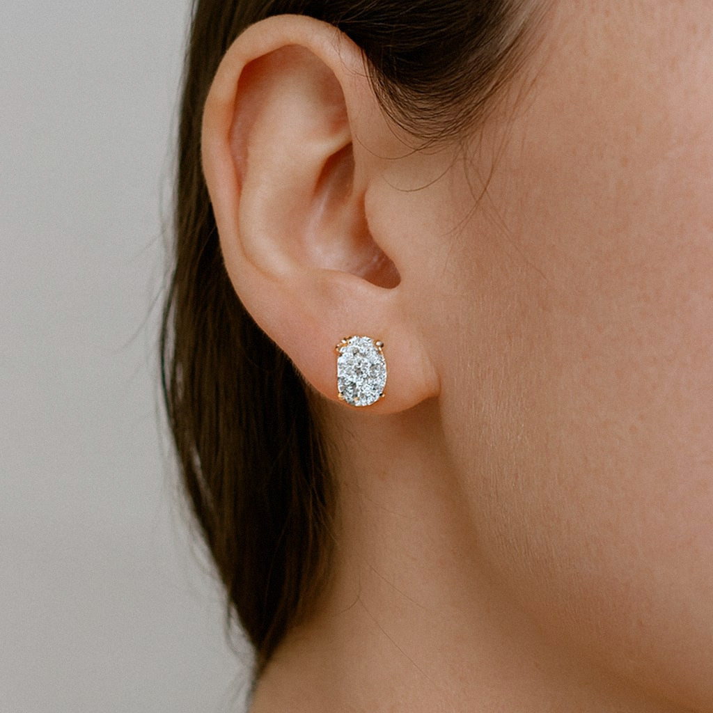 Gold Oval Moissanite Stud Earrings, 18k Gold Plated Sterling Silver, worn on model for scale