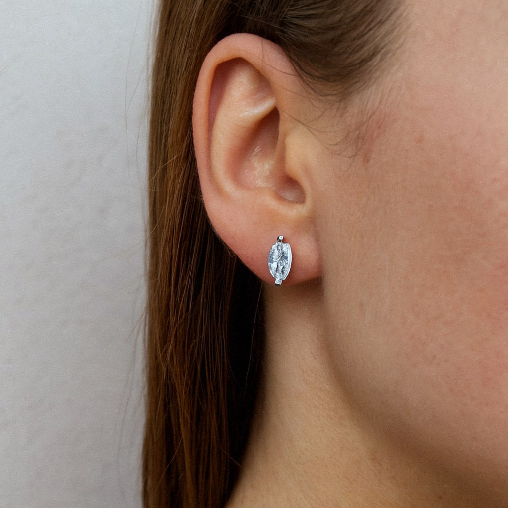 Marquise Moissanite Stud Earrings, 925 Sterling Silver, worn on model for scale