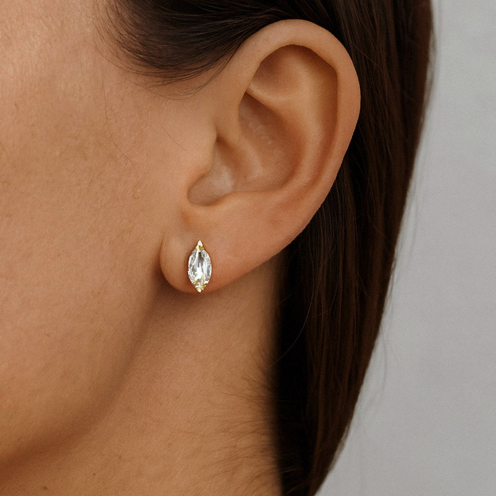 Gold Marquise Moissanite Stud Earrings, 18k Gold Plated Sterling Silver, worn on model for scale