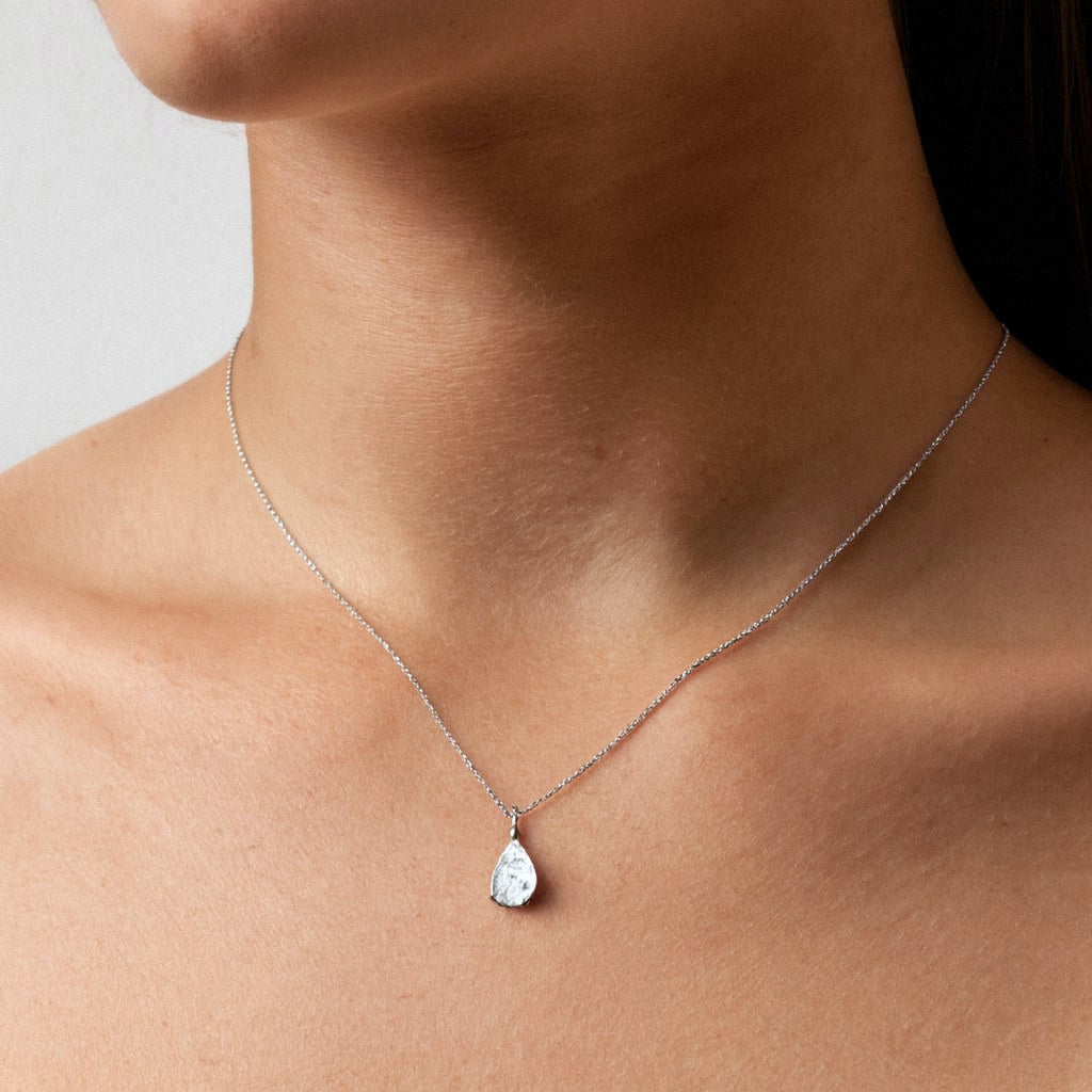 Pear Moissanite Necklace, Teardrop Solitaire Pendant in 925 Sterling Silver, worn on model for scale