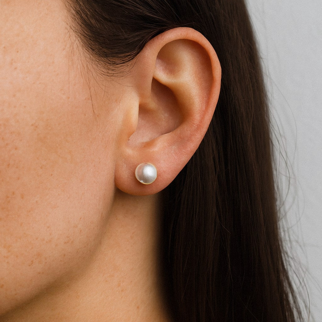 Button Pearl Stud Earrings, Freshwater Pearl Studs 6mm to 11mm, Sterling Silver, worn on model for scale
