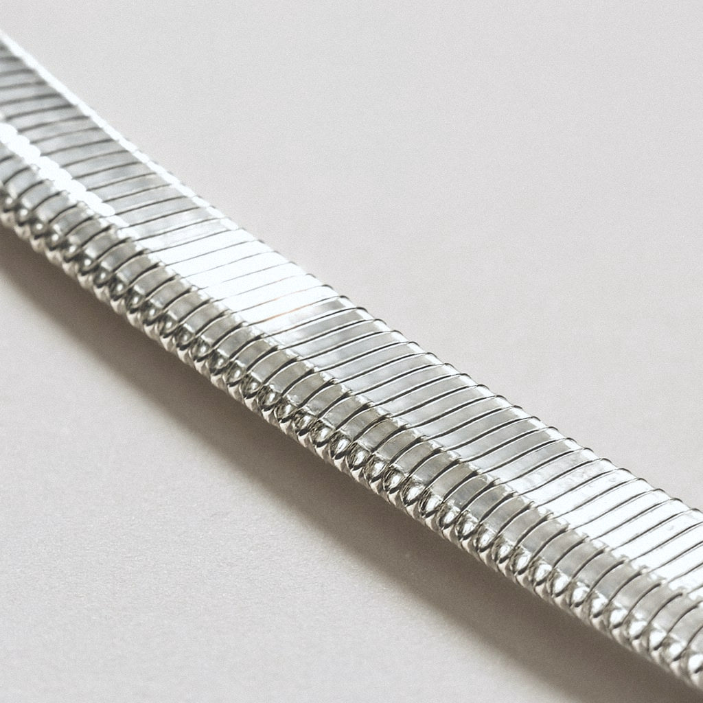 Silver Herringbone Chain Necklace, 925 Sterling Silver, close-up of the flat polished links