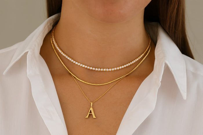 Gold necklaces layered